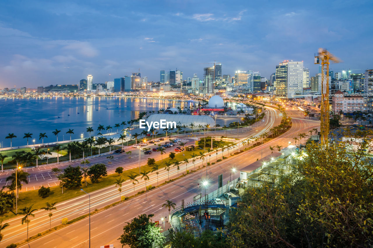 High angle view of city by road against sky