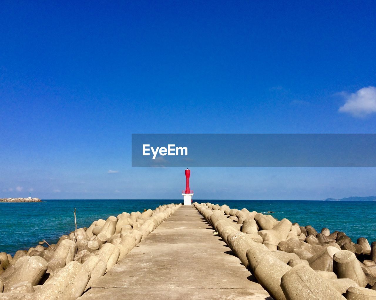 Scenic view of sea against blue sky