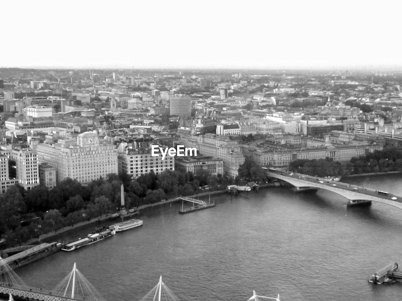 High angle view of river and cityscape against sky