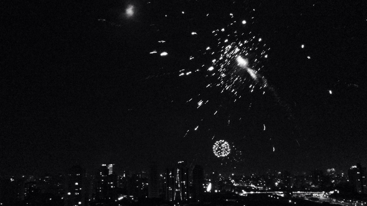 FIREWORKS EXPLODING IN CITY