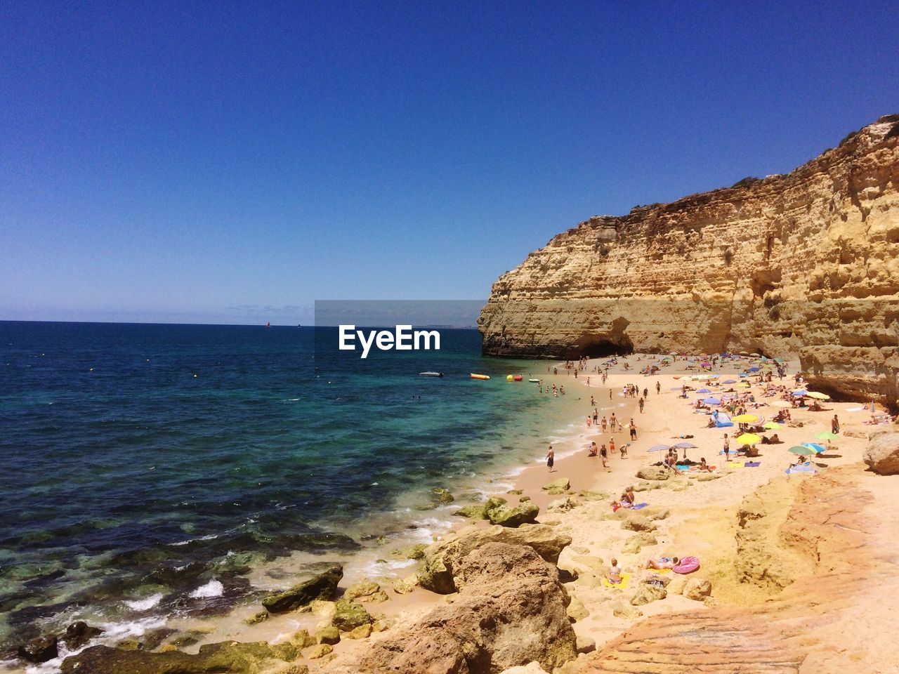 Scenic view of sea against blue sky