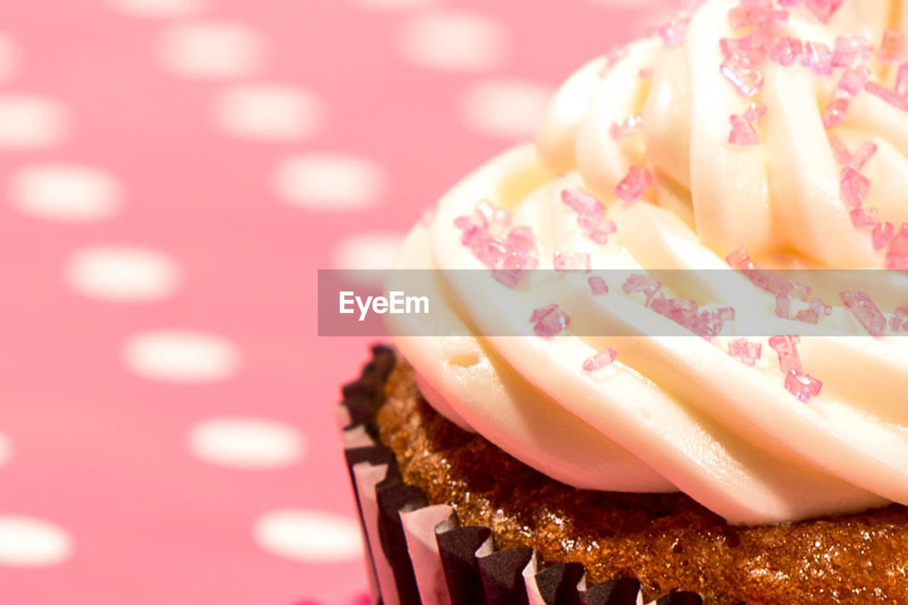 Cropped image of cupcake on table