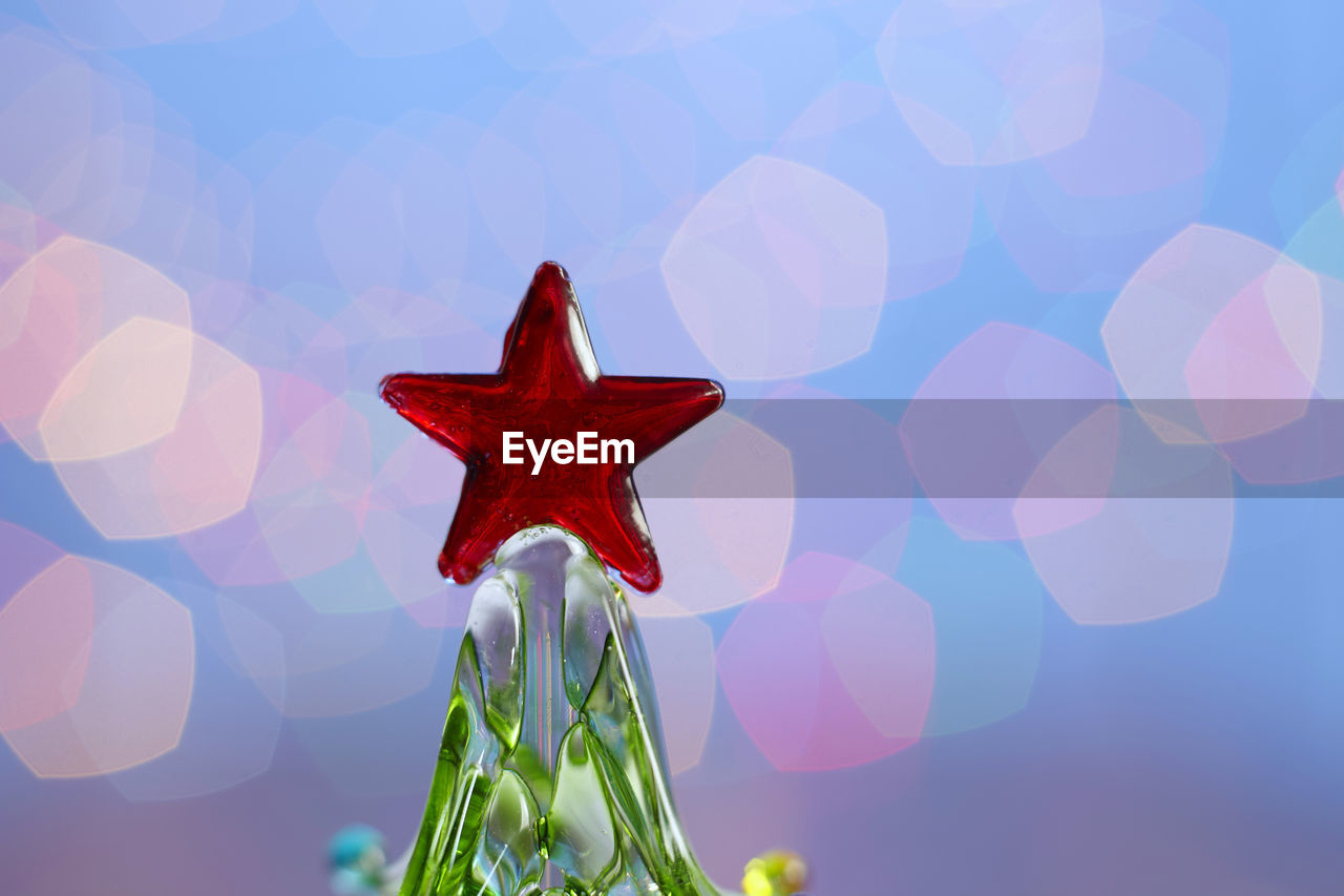 CLOSE-UP OF RED UMBRELLA AGAINST SKY