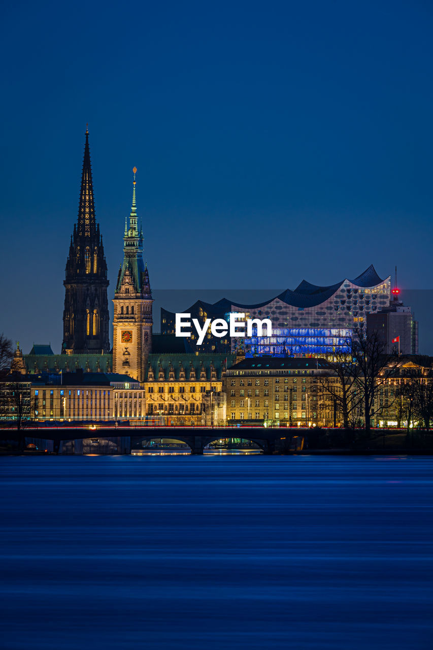 Illuminated buildings in city at night