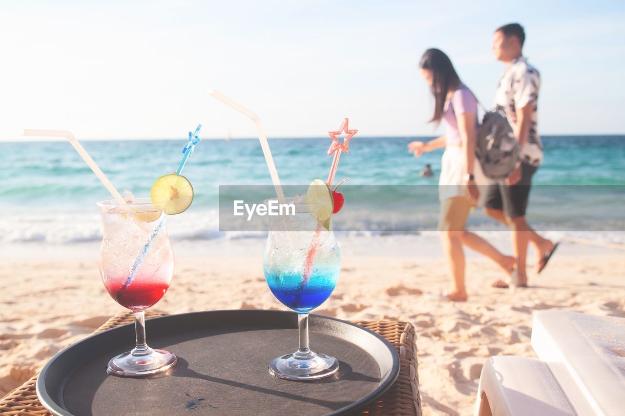 PANORAMIC VIEW OF PEOPLE AT BEACH