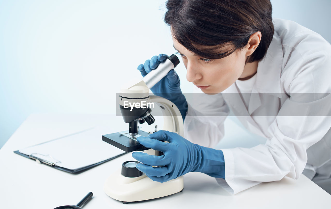 female doctor examining patient in laboratory