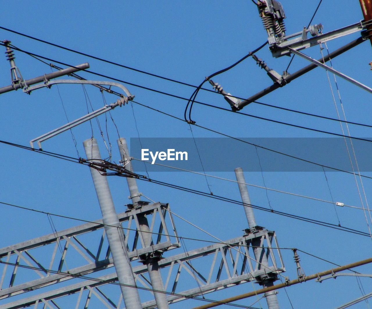 Part of pylon against blue sky