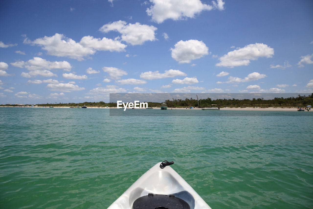 BOAT ON SEA AGAINST SKY