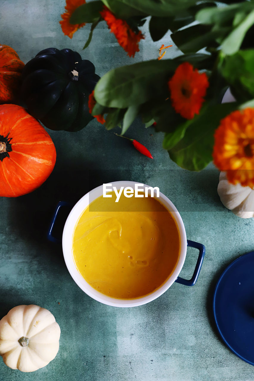 high angle view of pumpkin soup in bowl on table