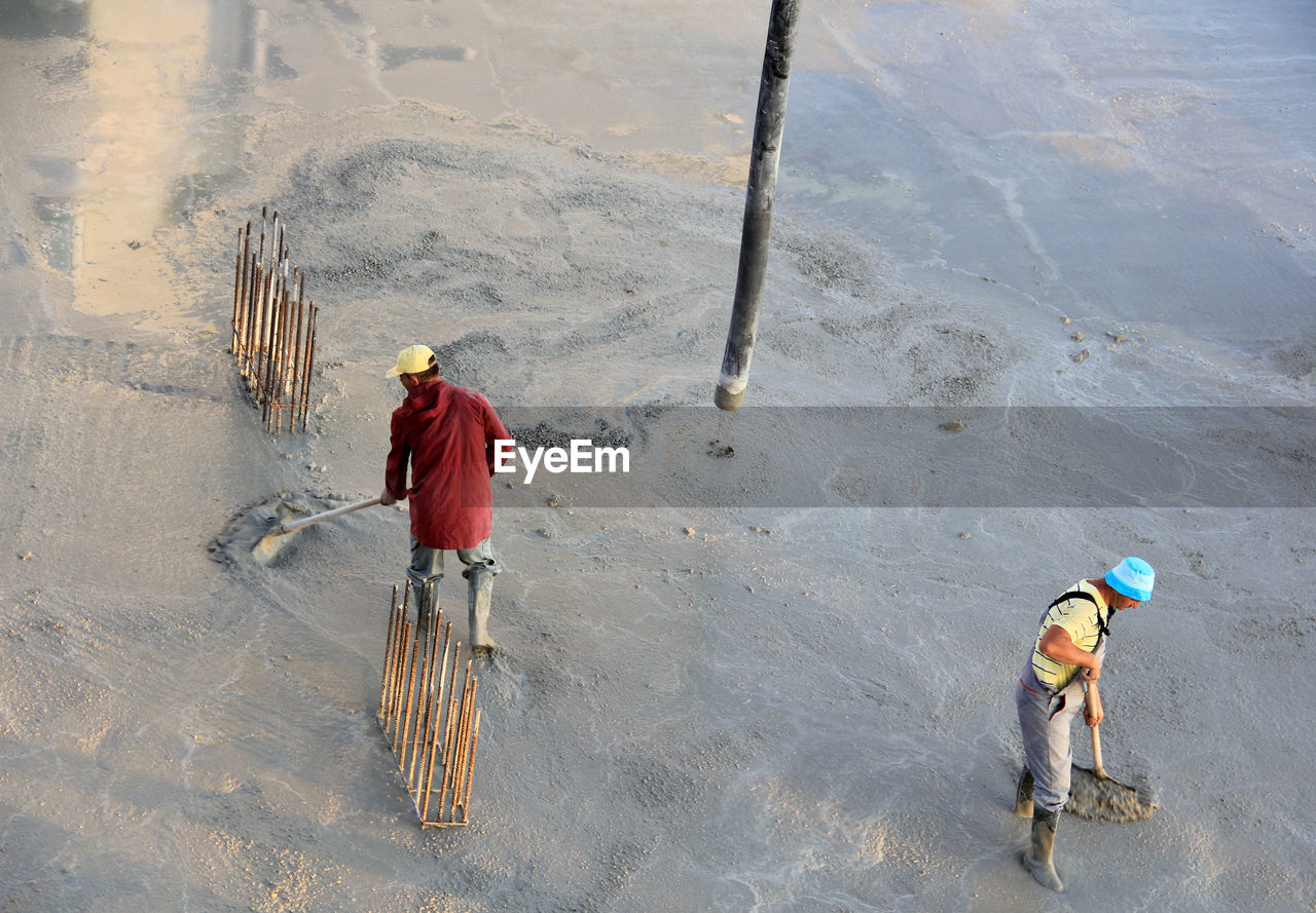 High angle view of men working at construction site