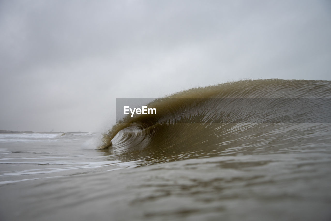 Water surface shot of rolling surf in sea