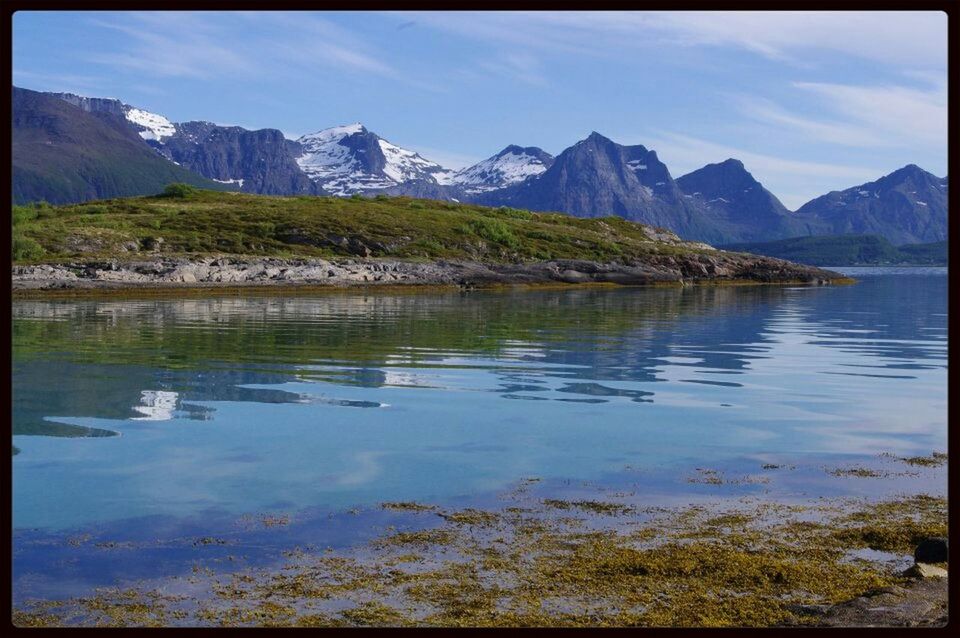 SCENIC VIEW OF LAKE BY MOUNTAINS