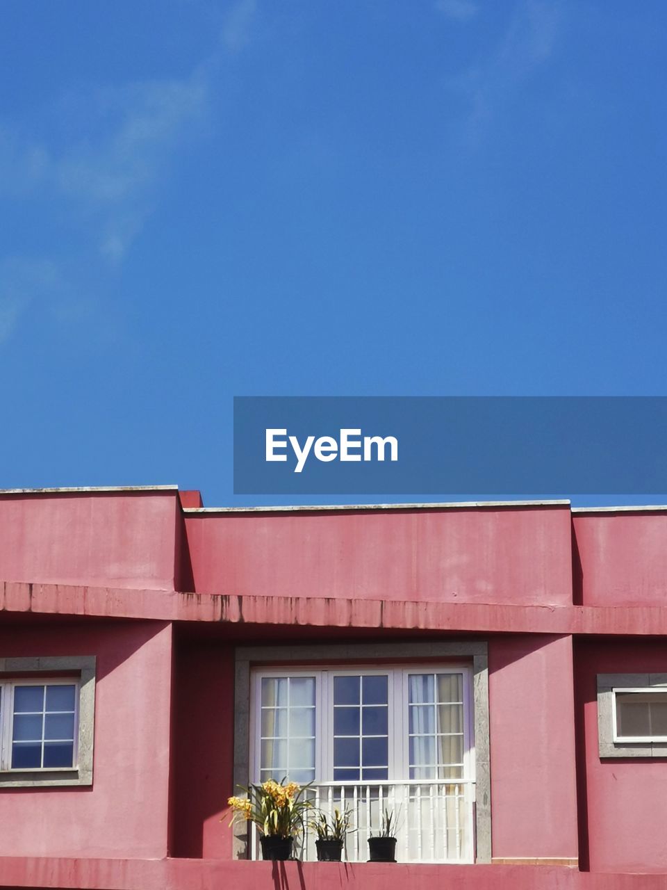 Low angle view of building against blue sky