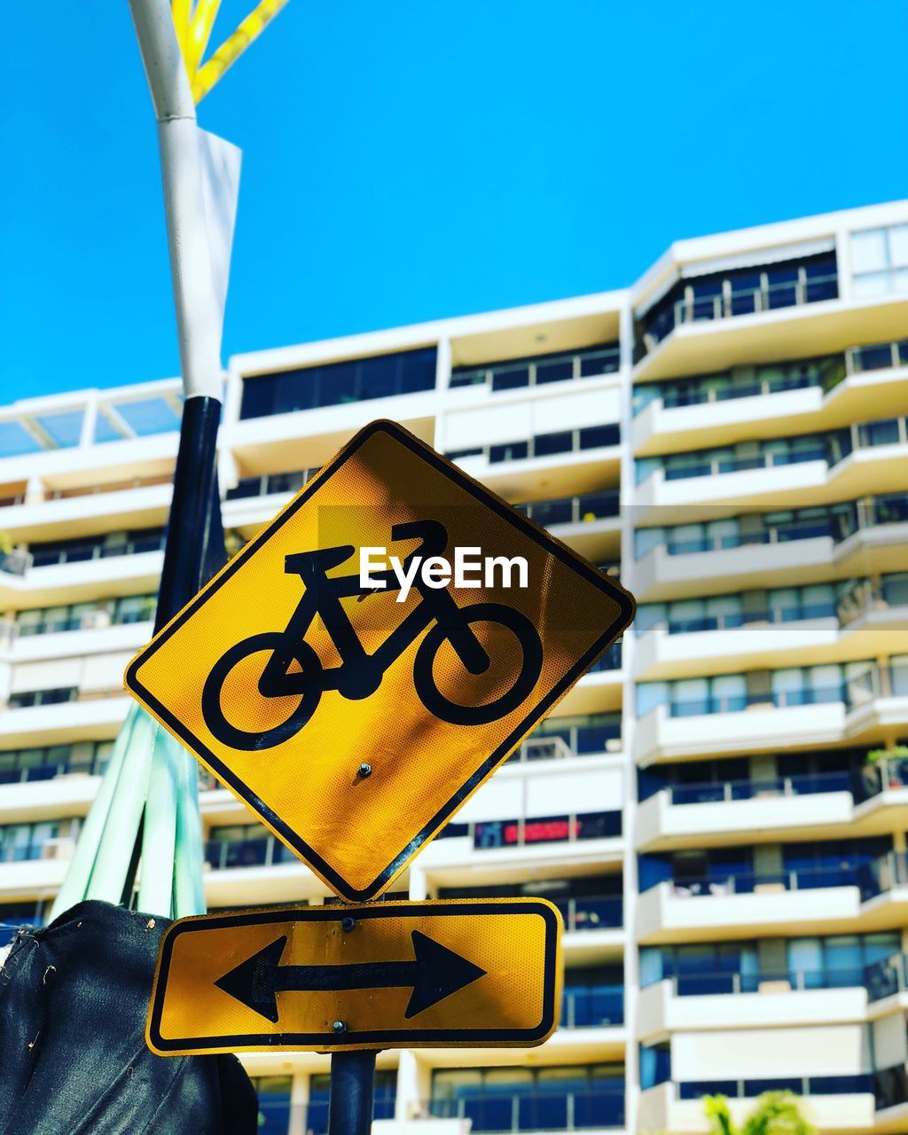 Low angle view of road sign against building