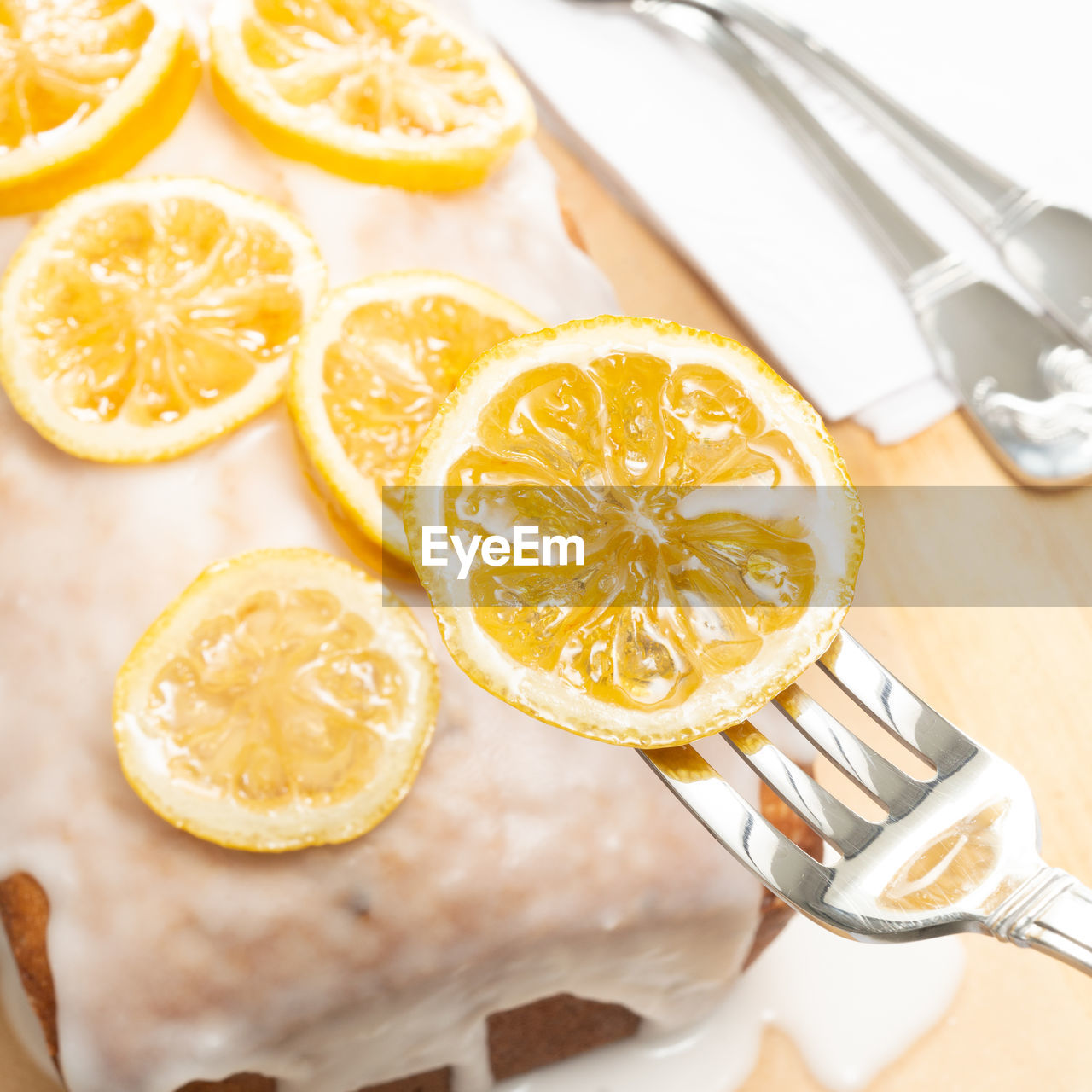 Delicious lemon cake topped with snowy lemon and candied lemon slices