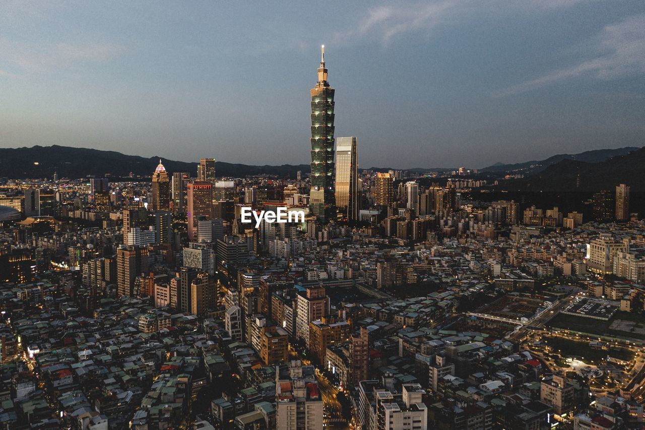 Aerial view of cityscape against sky during dusk