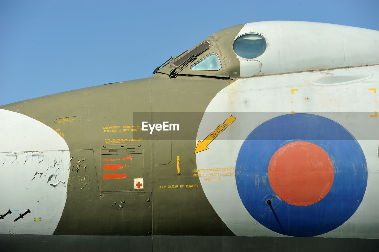 CLOSE-UP OF AIRPLANE AGAINST SKY