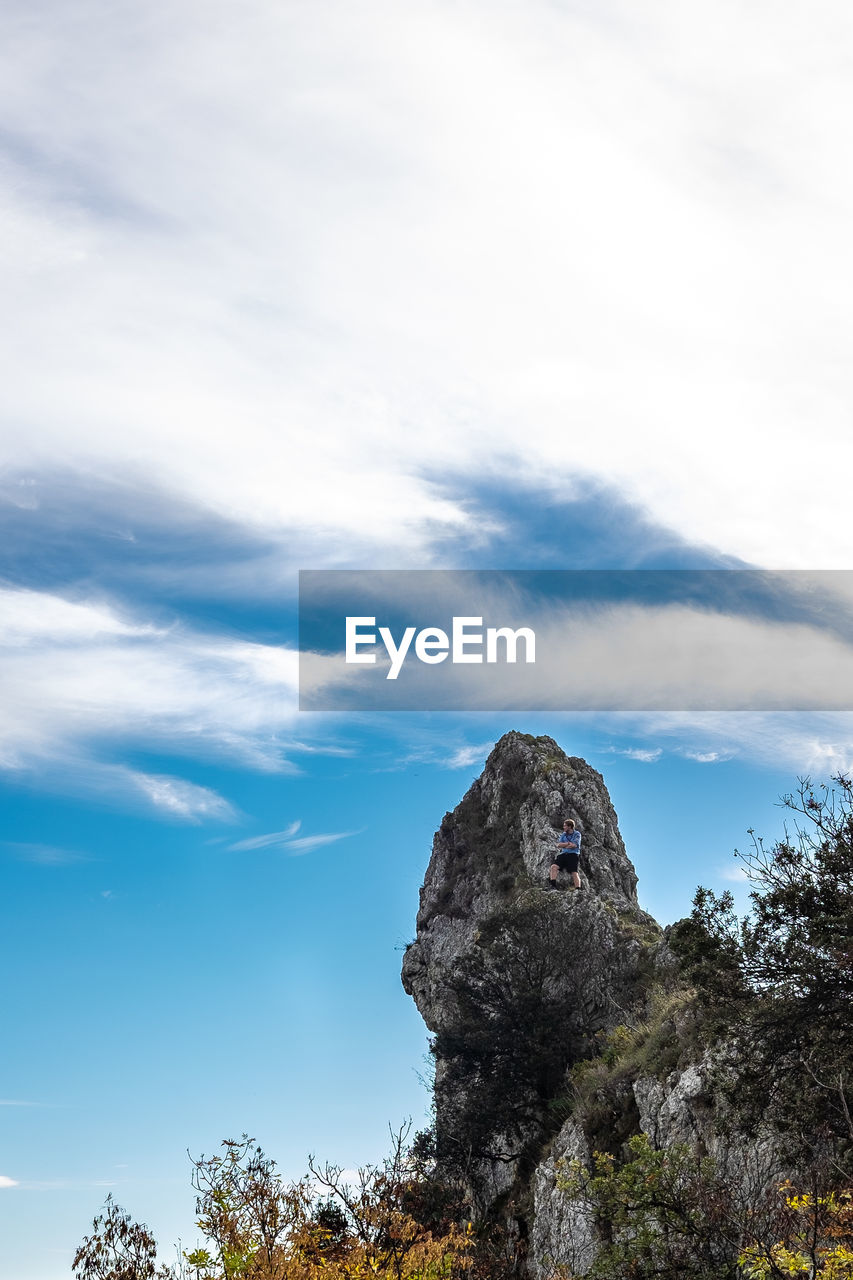 Low angle view of rock formation against sky