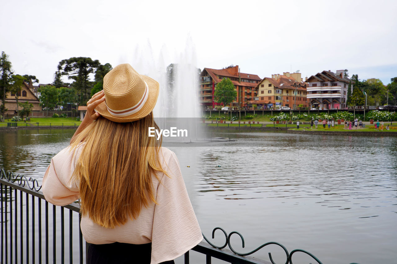 Stylish young woman visiting gramado town, serra gaucha, rio grande do sul, brazil.