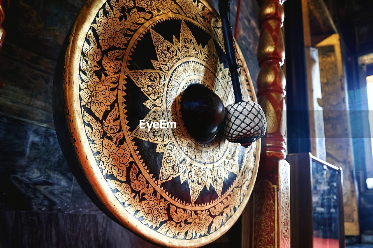 Close-up of gong at buddhist temple