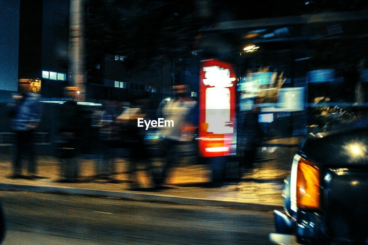 ILLUMINATED CITY STREET AT NIGHT