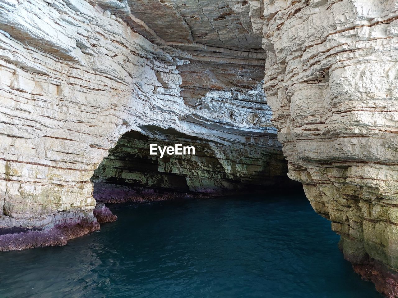 SCENIC VIEW OF SEA AND CAVE