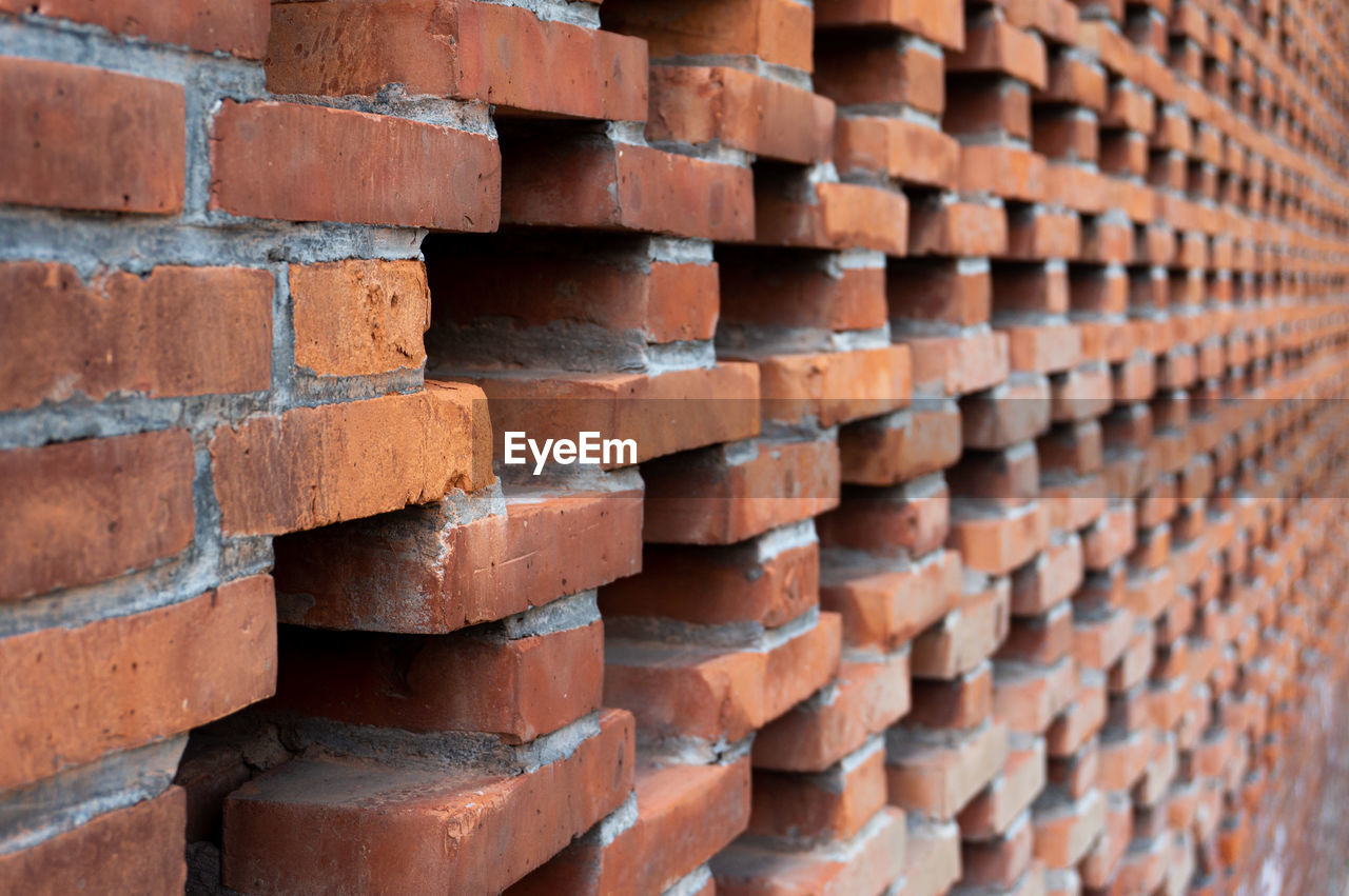 FULL FRAME SHOT OF STACK OF STONE WALL