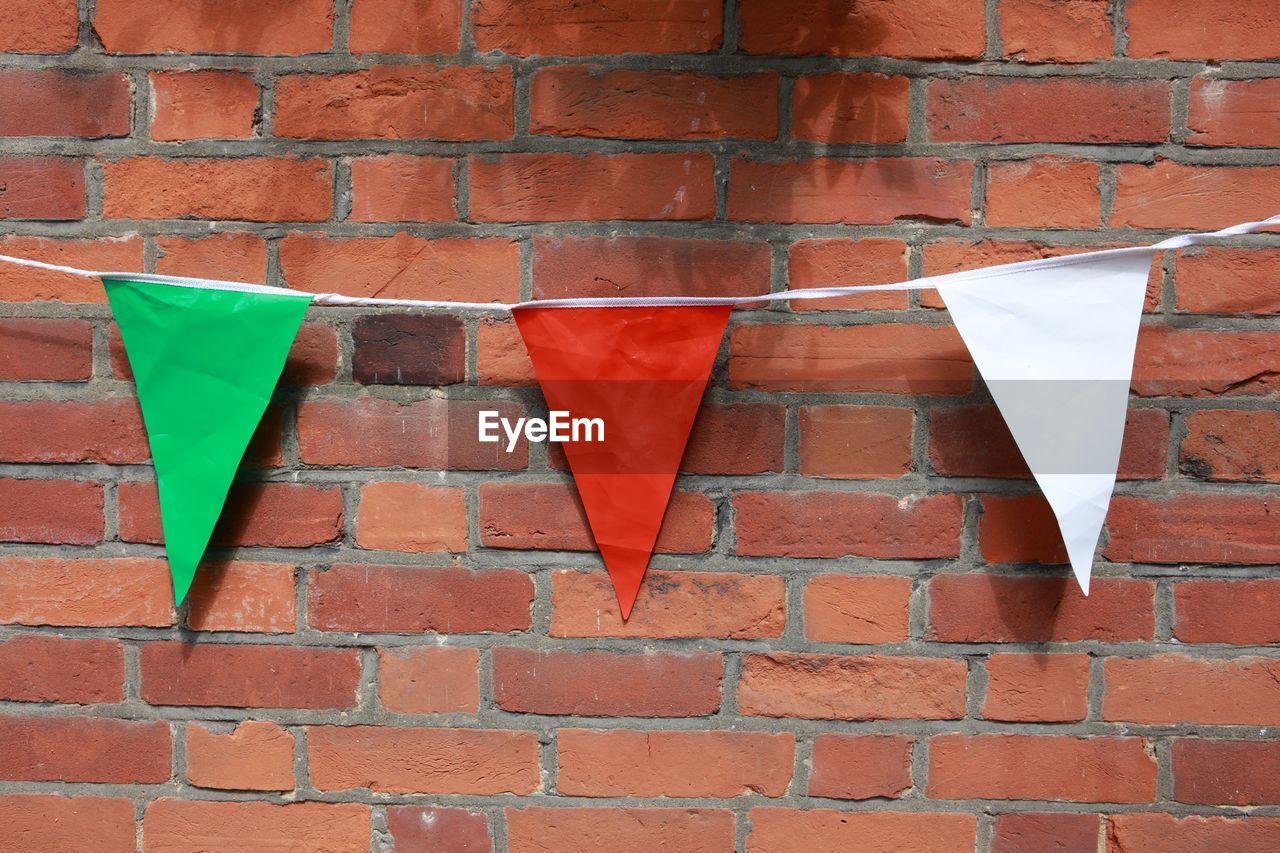 Bunting against brick wall