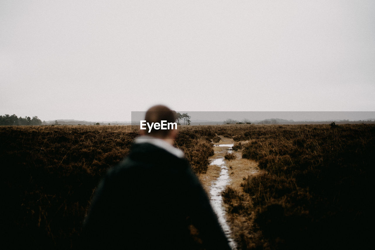 Defocused image of man standing on field