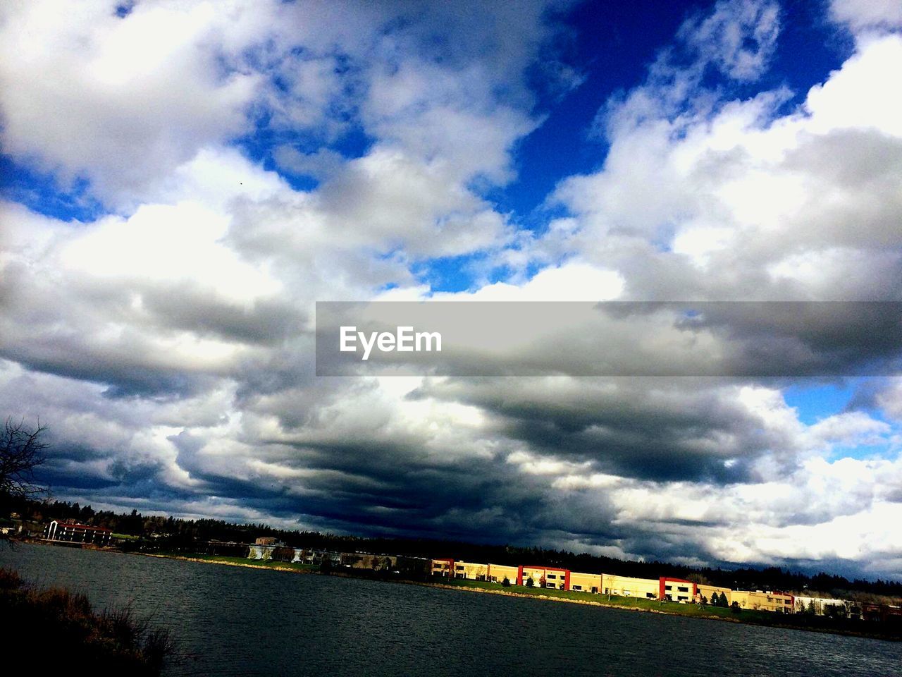 Tilt image of cloudy sky over river