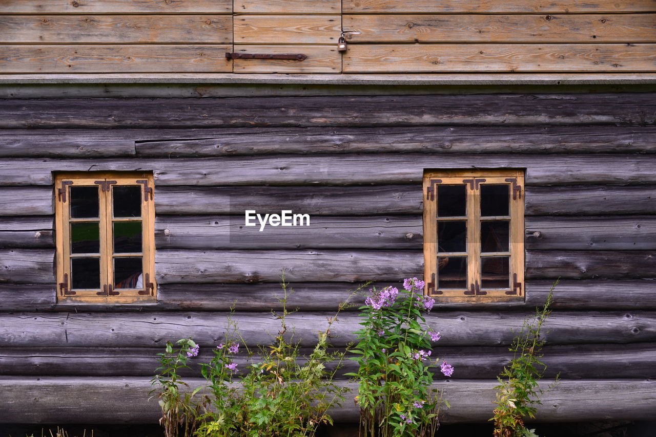 LOW ANGLE VIEW OF OLD WOODEN HOUSE