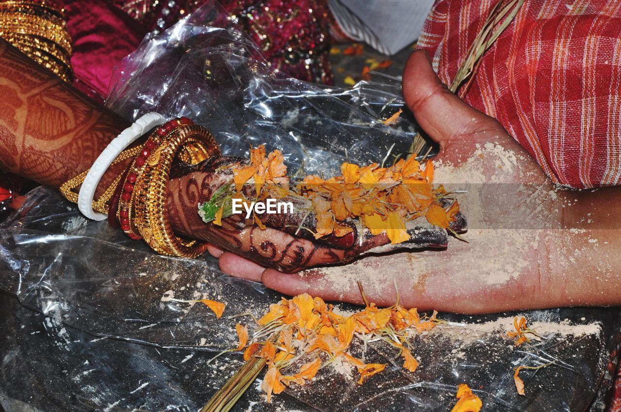 Cropped image of messy hands during wedding ceremony
