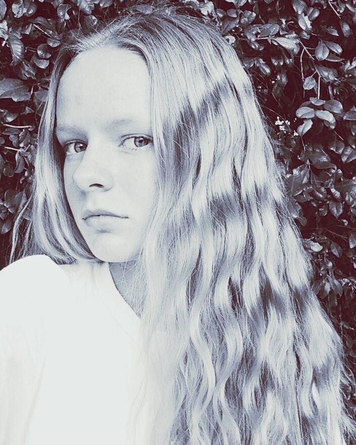 PORTRAIT OF YOUNG WOMAN IN HAIR