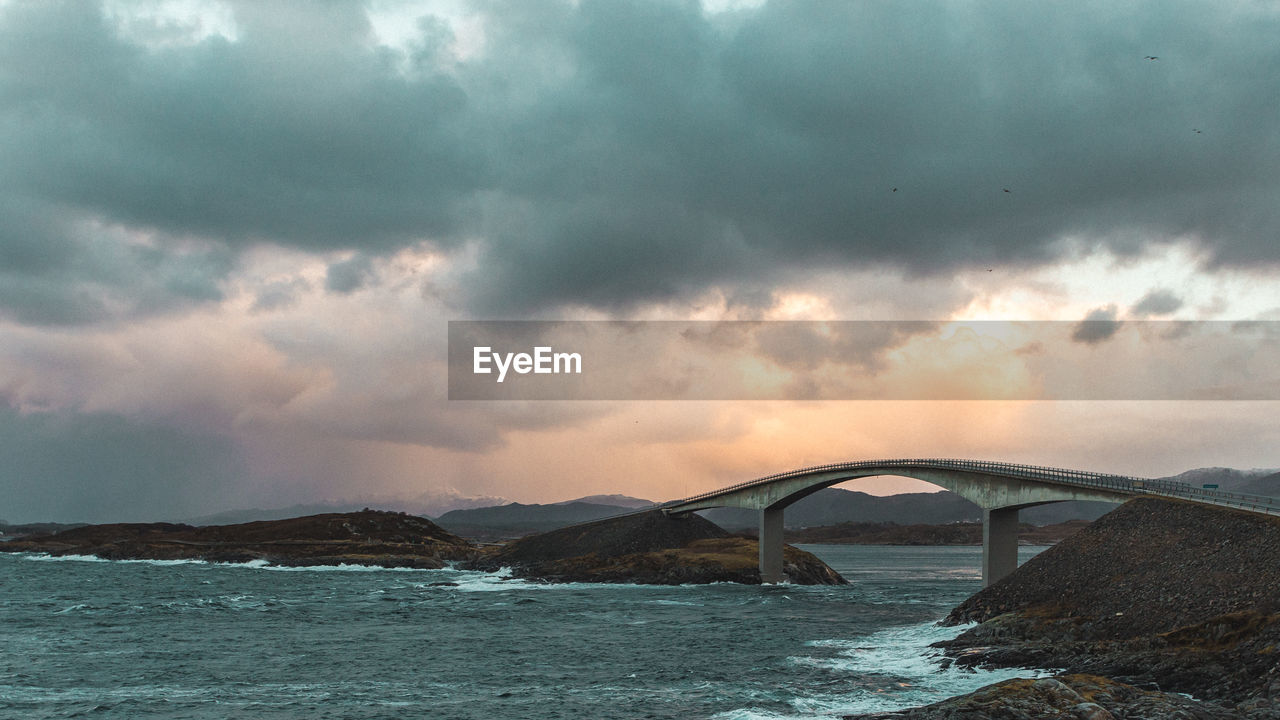 Scenic view of sea against storm clouds