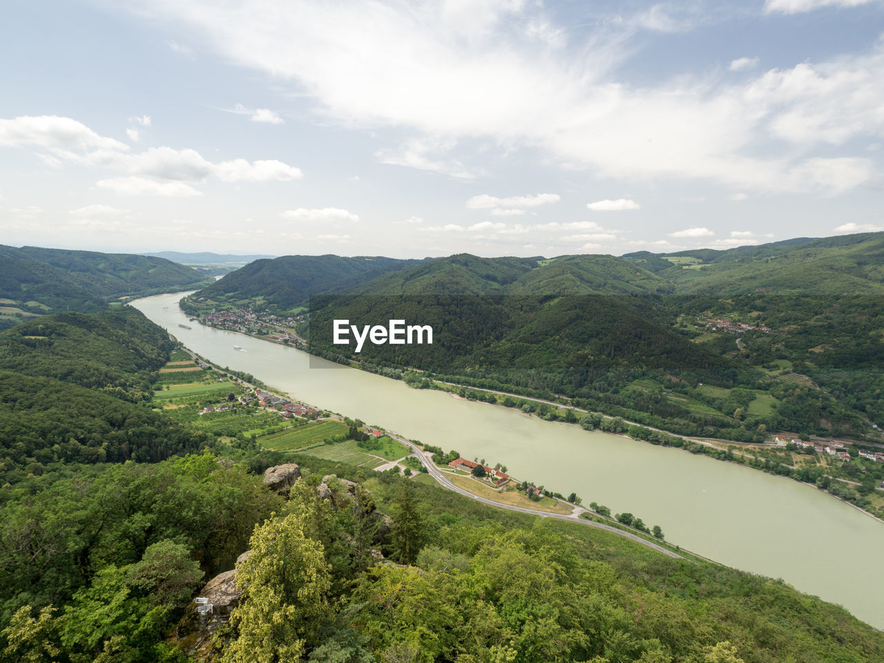 HIGH ANGLE VIEW OF TREES AND MOUNTAINS AGAINST SKY