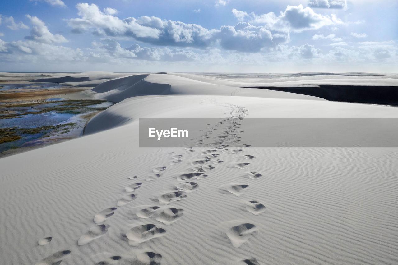 Scenic view of desert against sky during winter