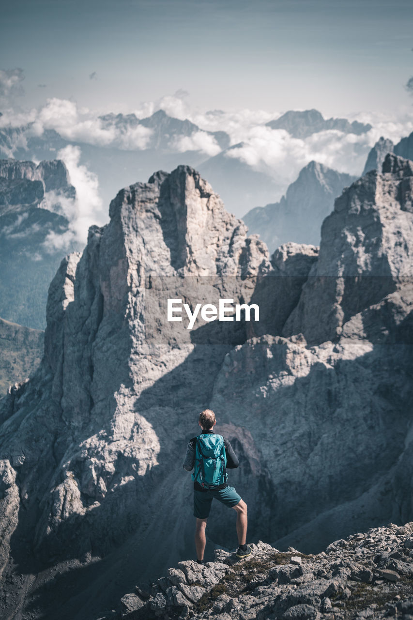 Hiker standing on cliff