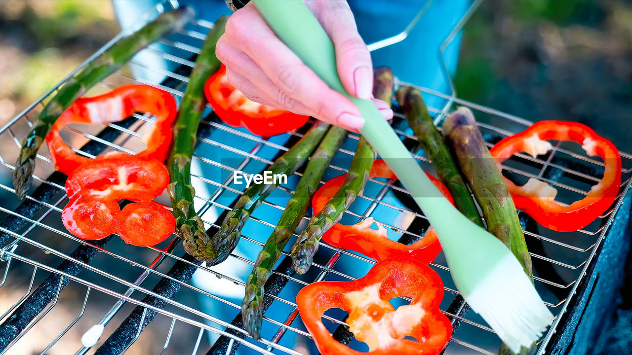 food, hand, food and drink, red, outdoors, day, barbecue grill, close-up