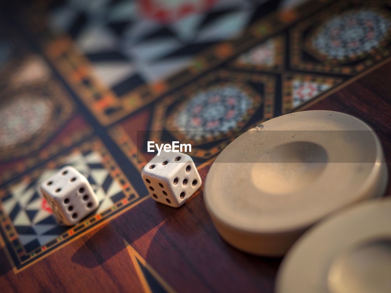 High angle view of dices on wooden table