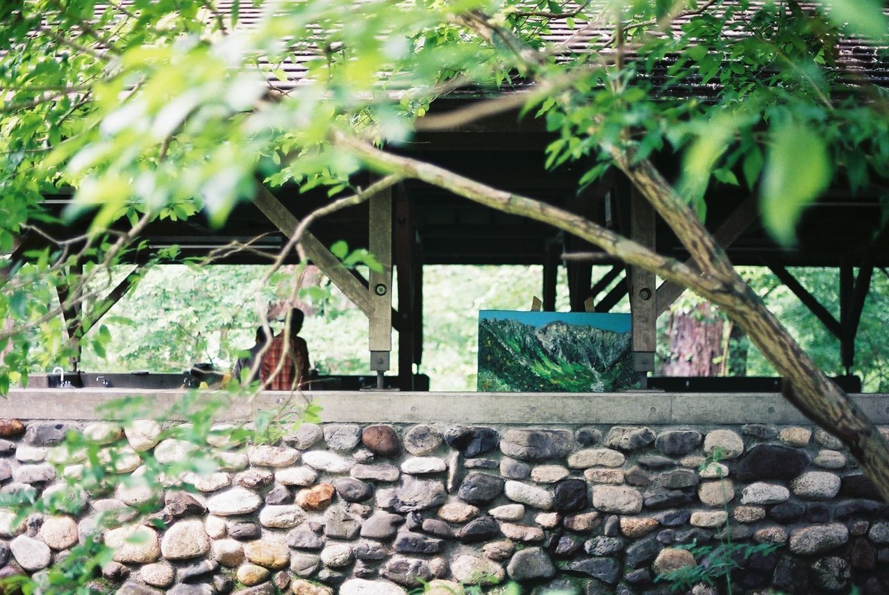 View of people standing below shade