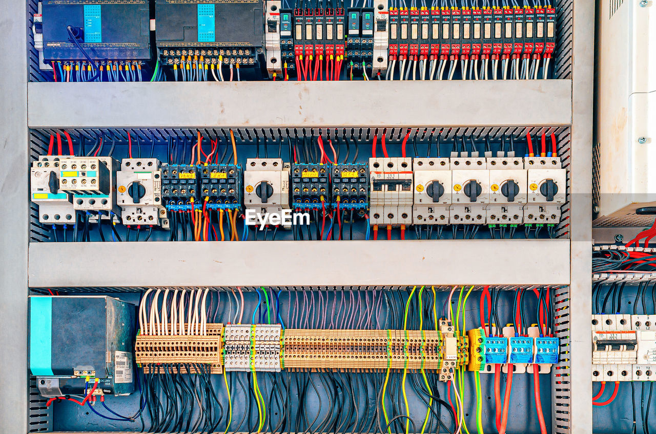 Part of a production machine at a paving stone factory. control panel, wiring, switches.