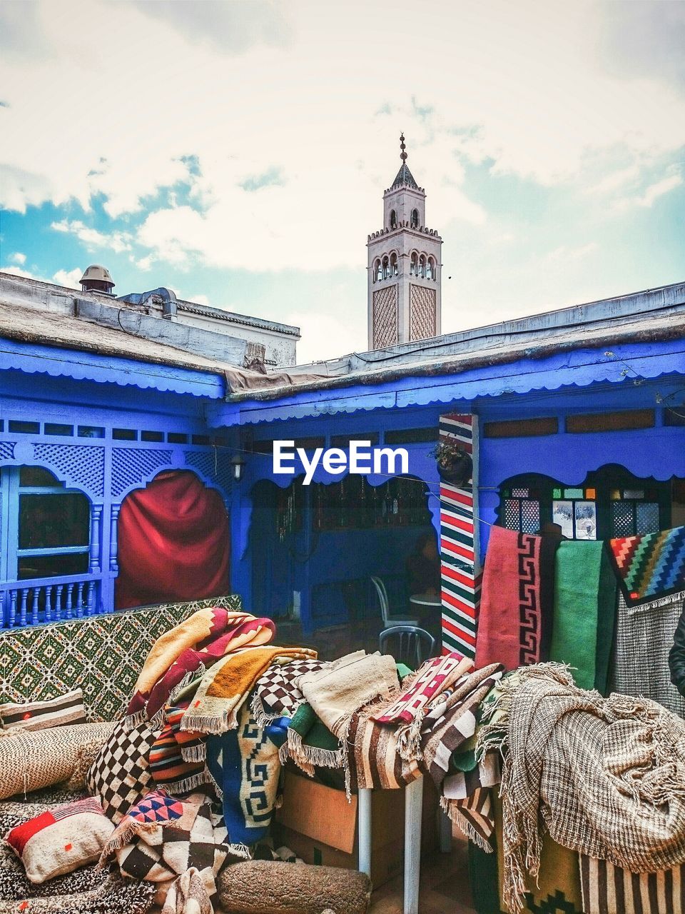 Clothes on table by mosque