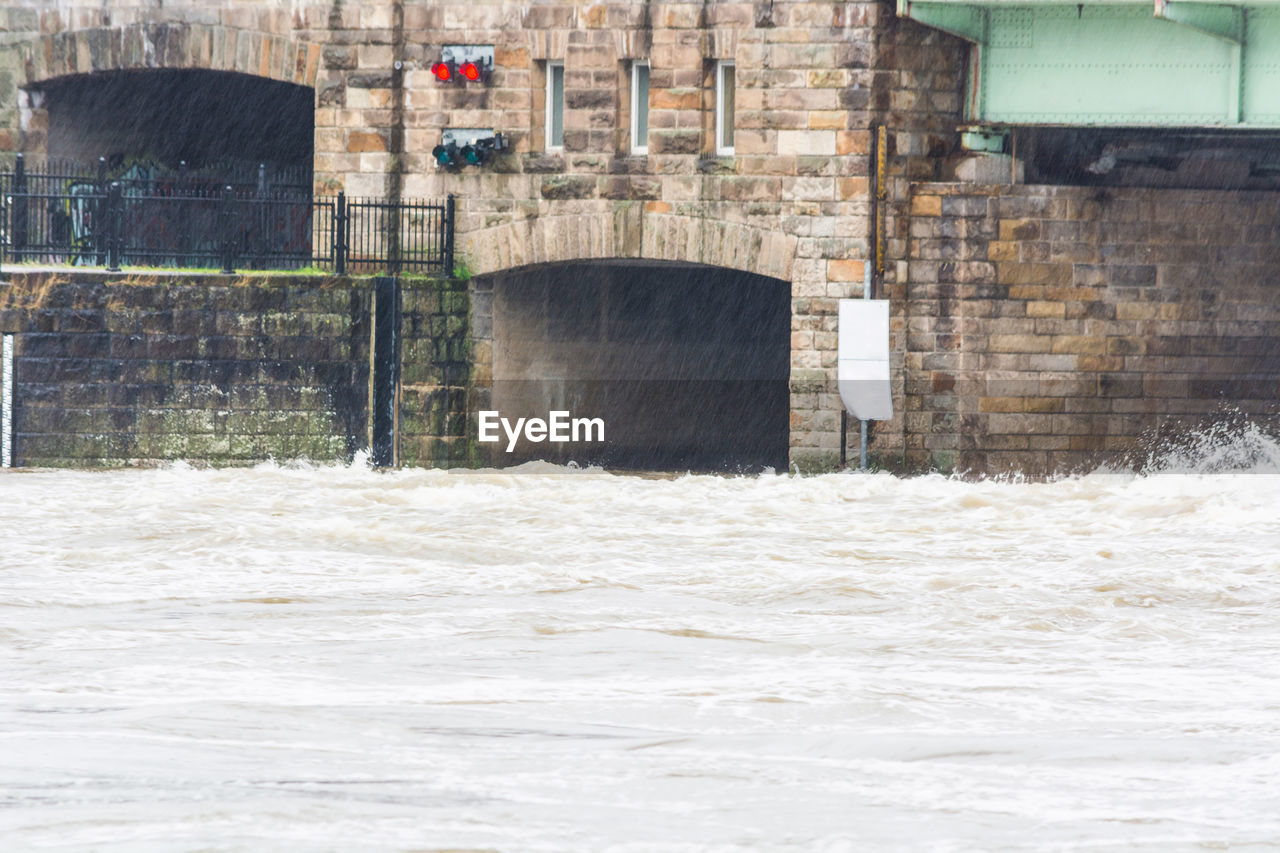 River by building on rainy day