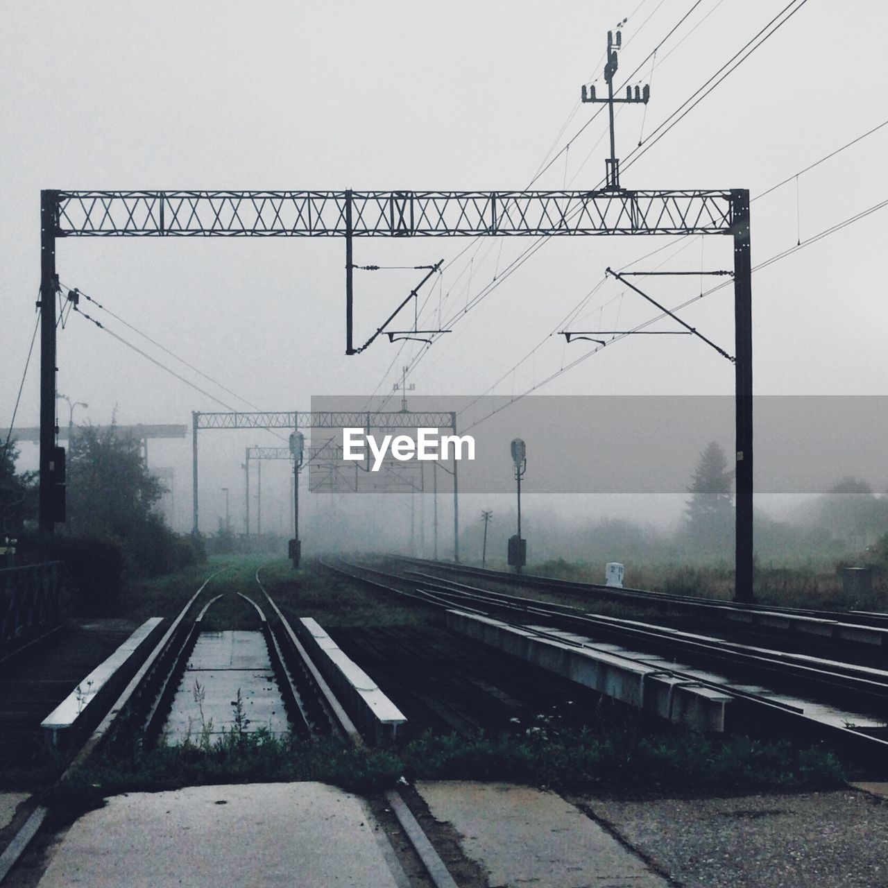 Railroad tracks in foggy weather
