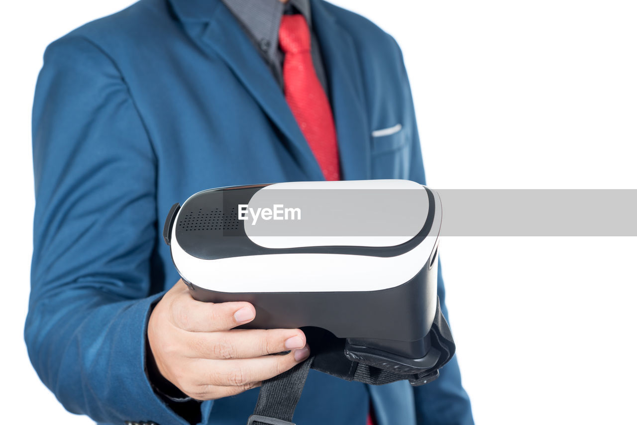Close-up of man holding virtual reality simulator