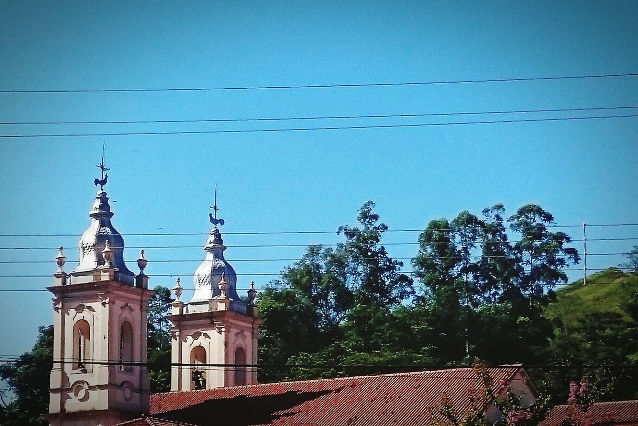 Low angle view of building against blue sky