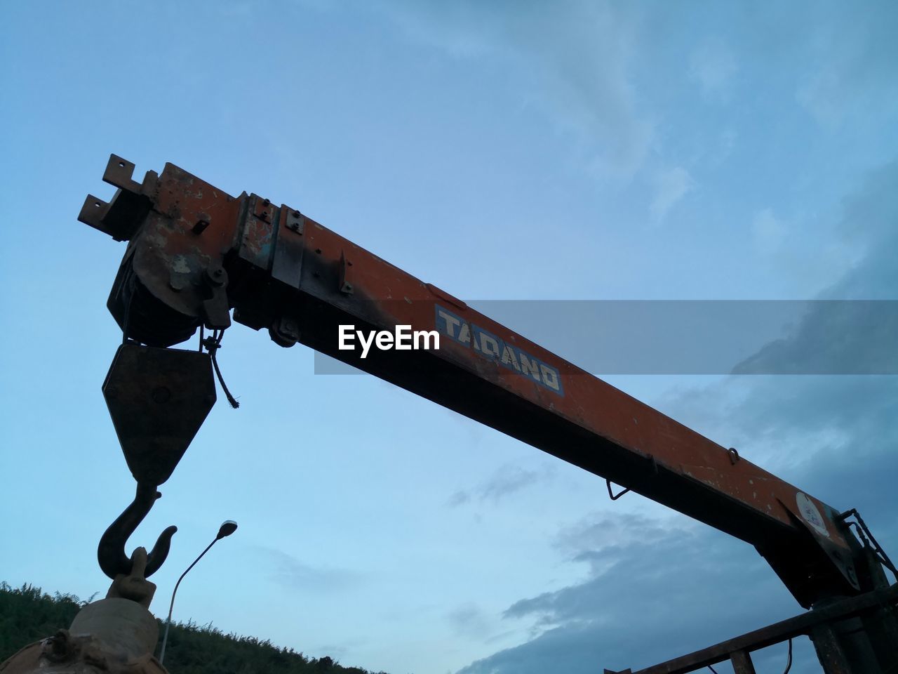 LOW ANGLE VIEW OF TRAIN ON METAL AGAINST SKY