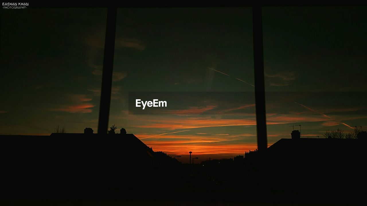 LOW ANGLE VIEW OF SILHOUETTE BUILT STRUCTURES AGAINST SKY