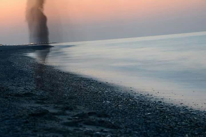 SURFACE LEVEL OF SEA AT SUNSET