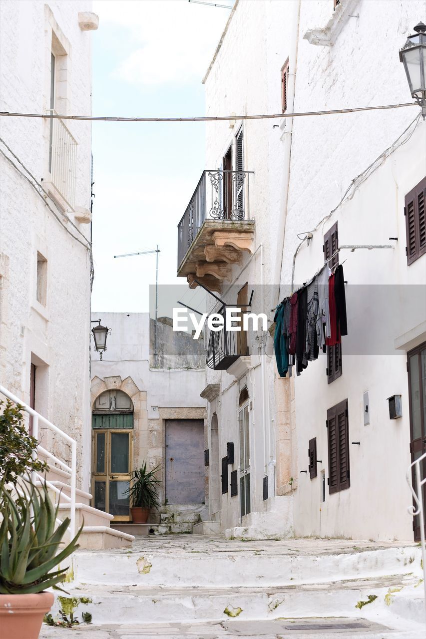 Low angle view of clothes drying outside building